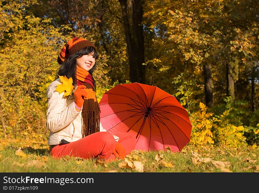 Young woman on the autumn leaf