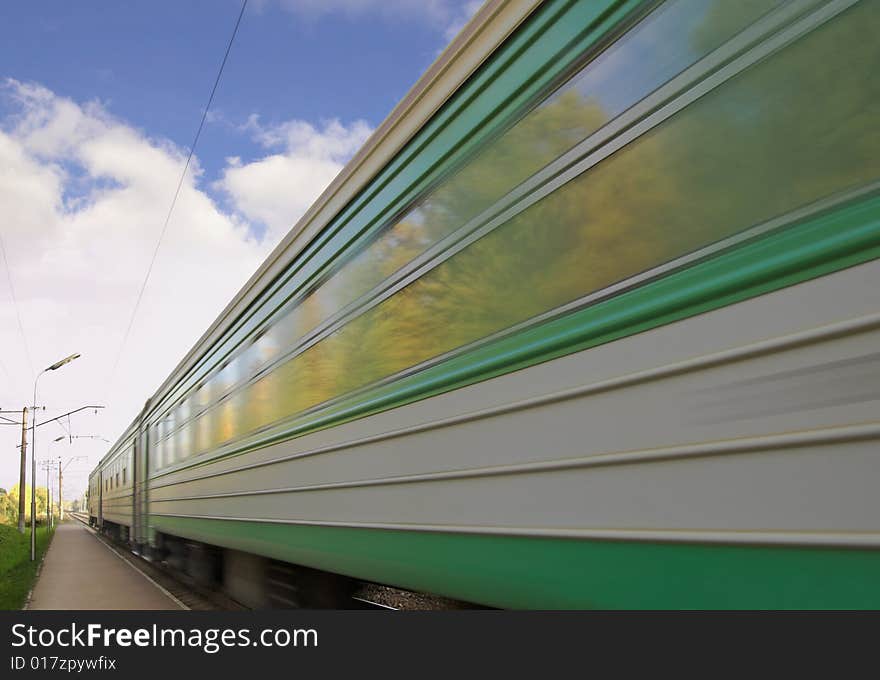 The electric train arrives to station. The electric train arrives to station.