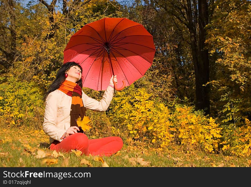 Young pretty woman in the autumn park. Young pretty woman in the autumn park