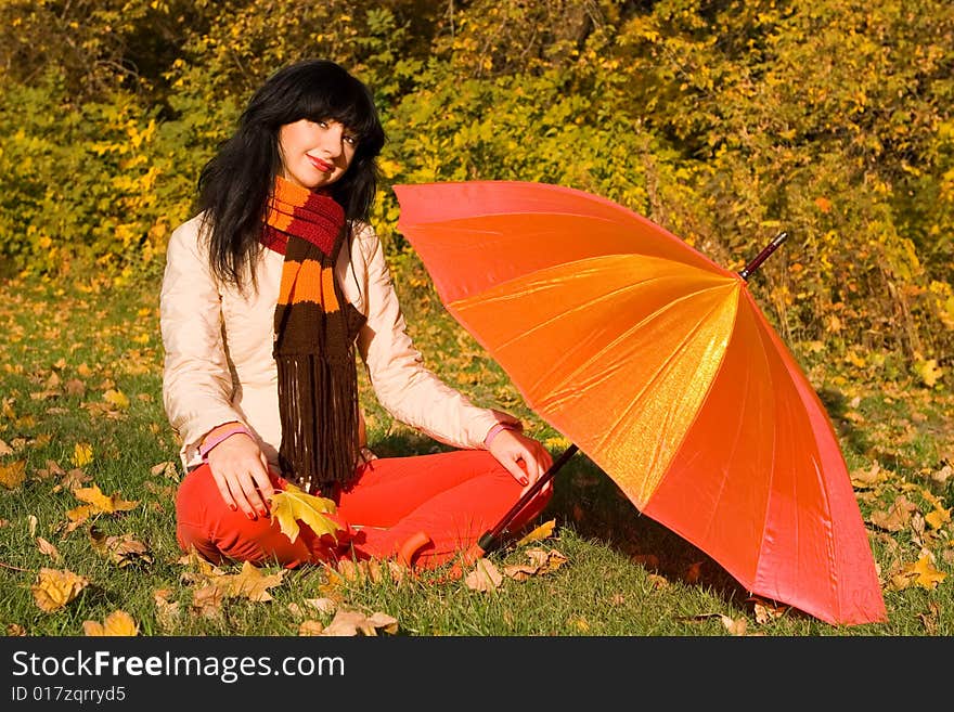 Young Woman In The Autumn Park