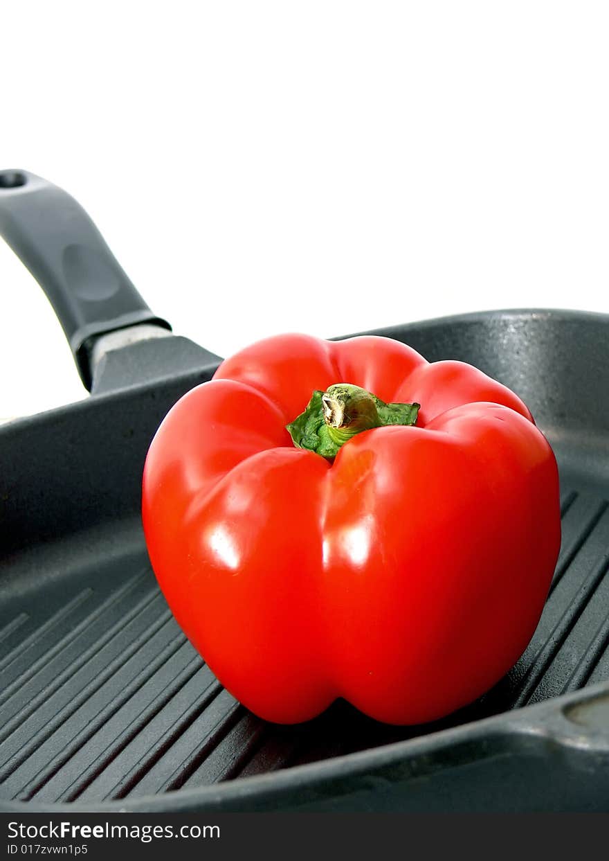 Detail of the red paprica in the frying pan with slant stripes. Detail of the red paprica in the frying pan with slant stripes.