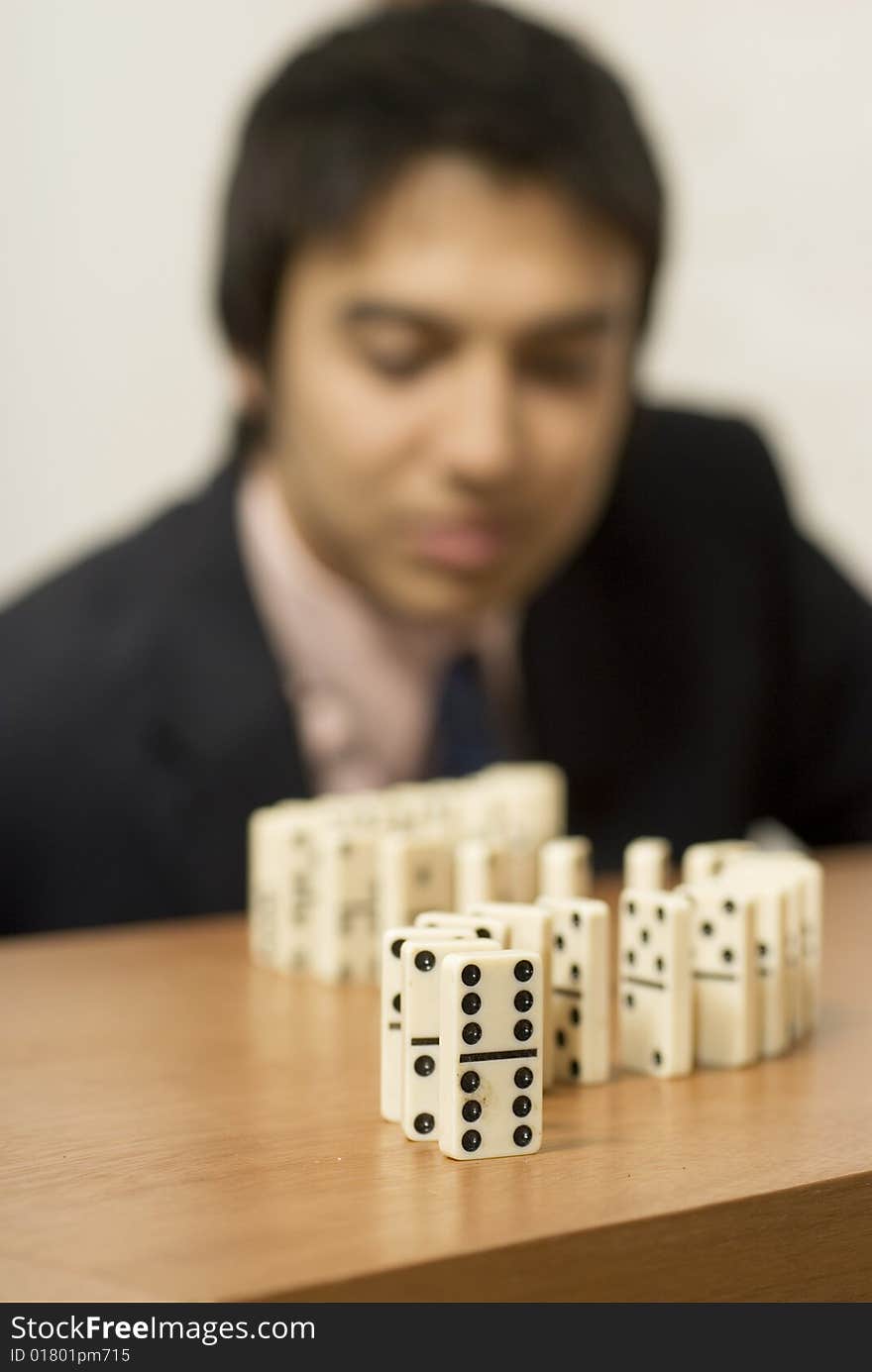 Man playing dominos. Vertically framed photo. Man playing dominos. Vertically framed photo.