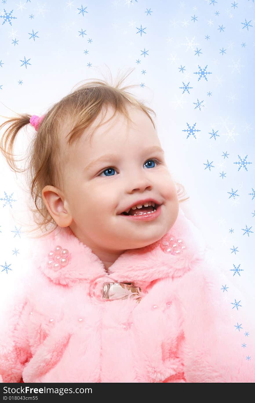 Cute little girl looking at snow flakes. Cute little girl looking at snow flakes