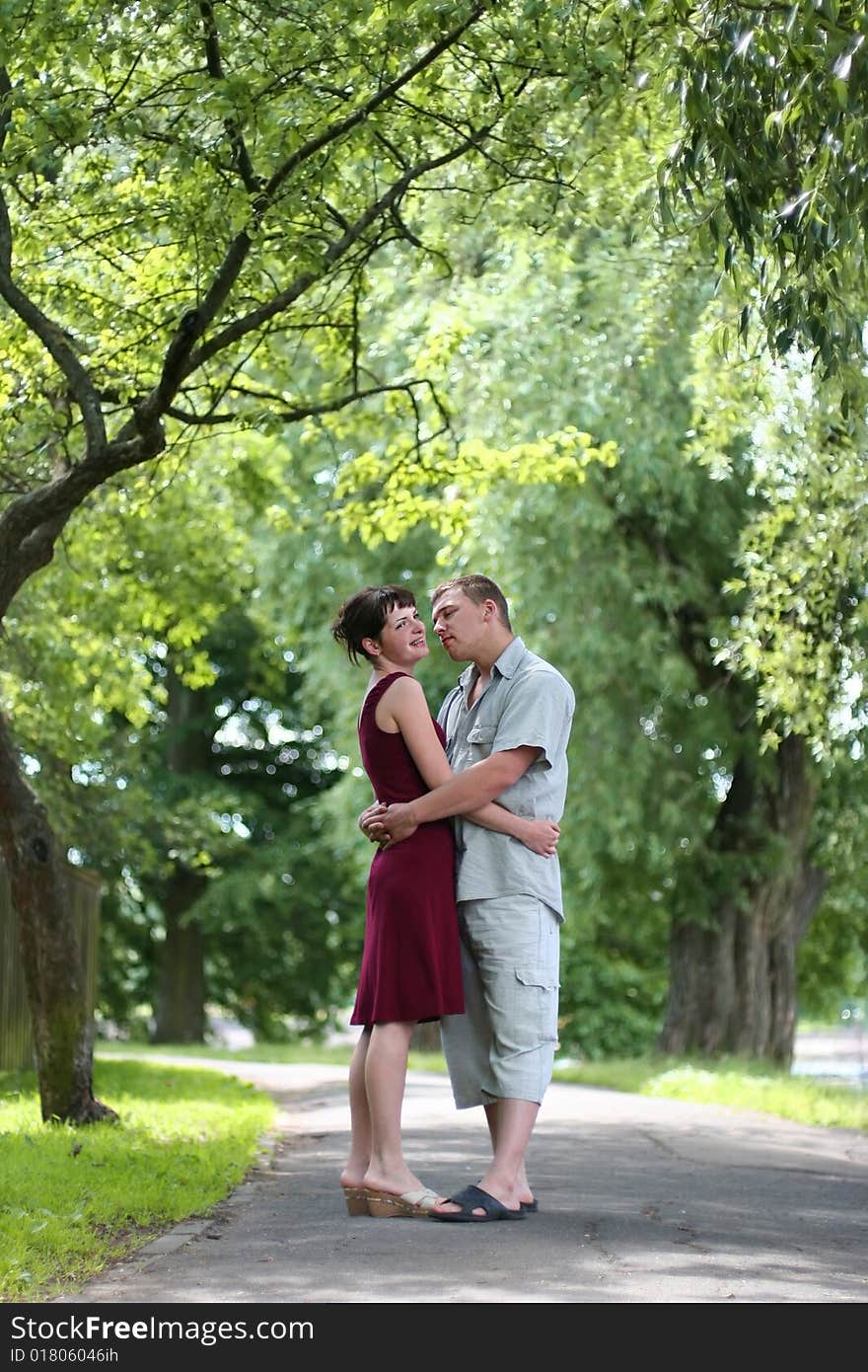 Loving couple walking in park. Loving couple walking in park