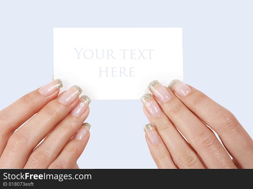 Woman holding card on blue background