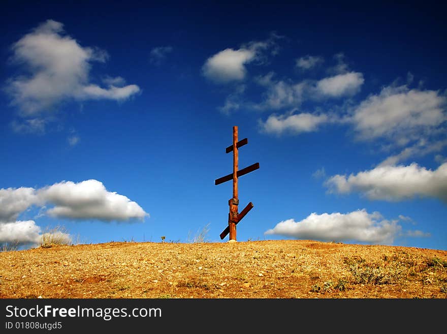 Eight-pointed [Russian] cross in mountains. Eight-pointed [Russian] cross in mountains