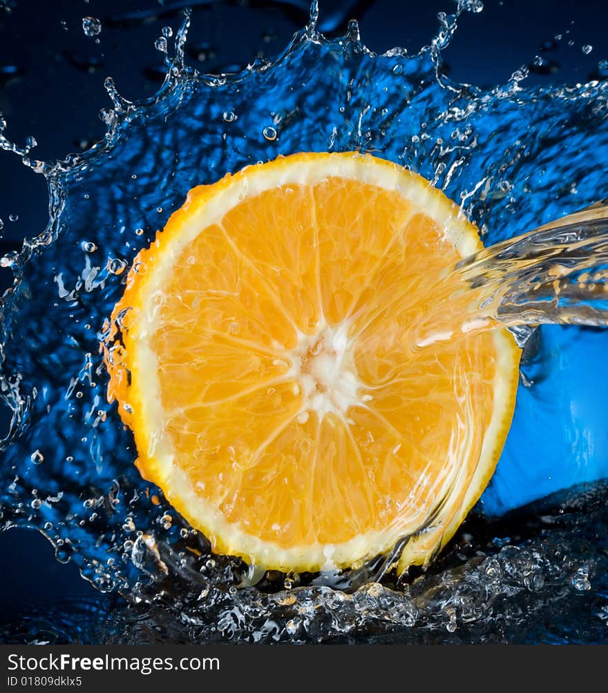 Orange with water splash, blue water. Orange with water splash, blue water