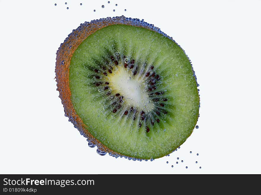 Green kiwi with creative bubbles.isolatid on white