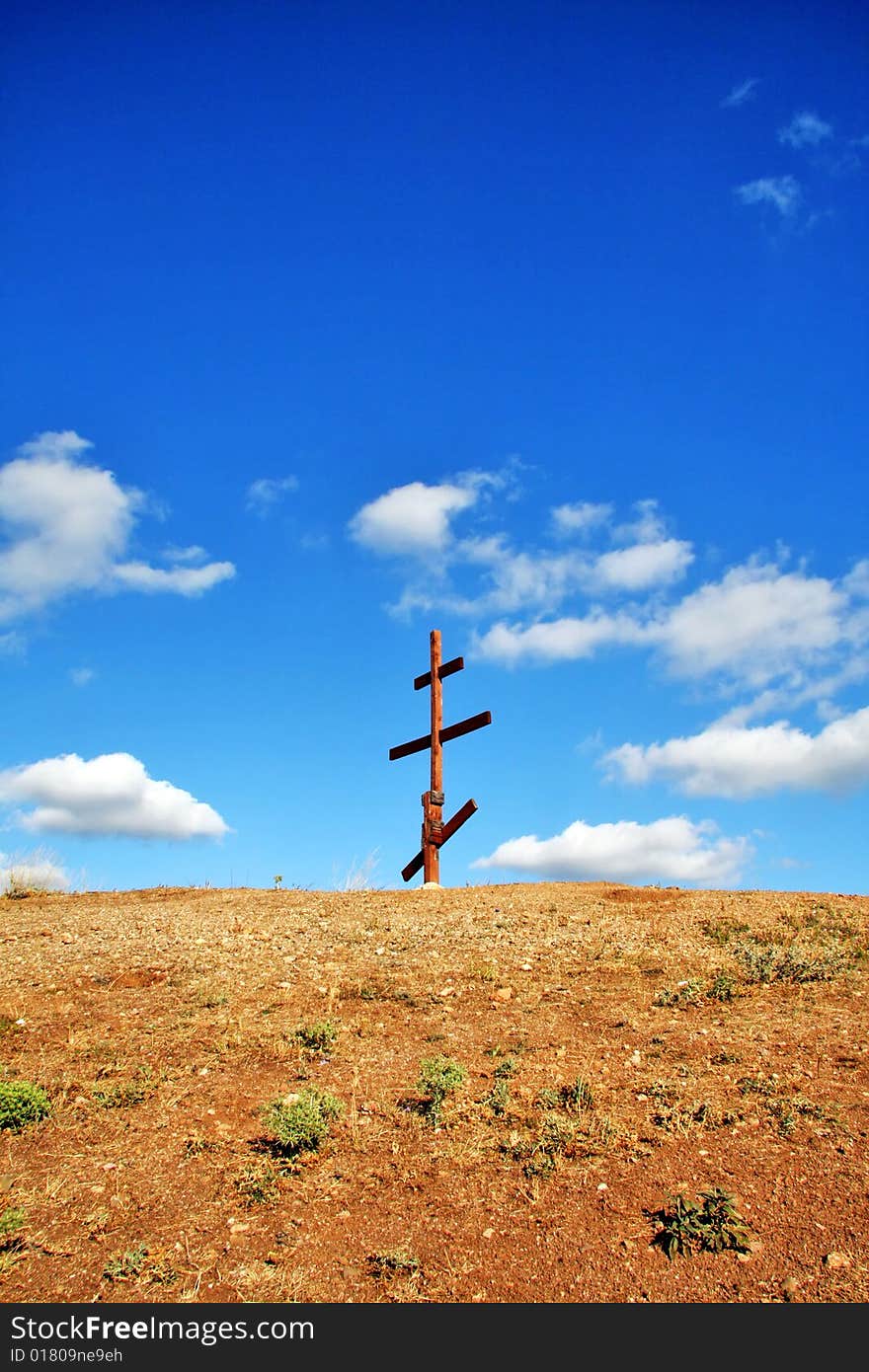 Eight-pointed [Russian] cross in mountains. Eight-pointed [Russian] cross in mountains