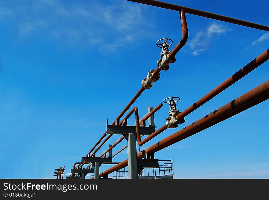 Industrial zone, Steel pipe-lines on blue sky