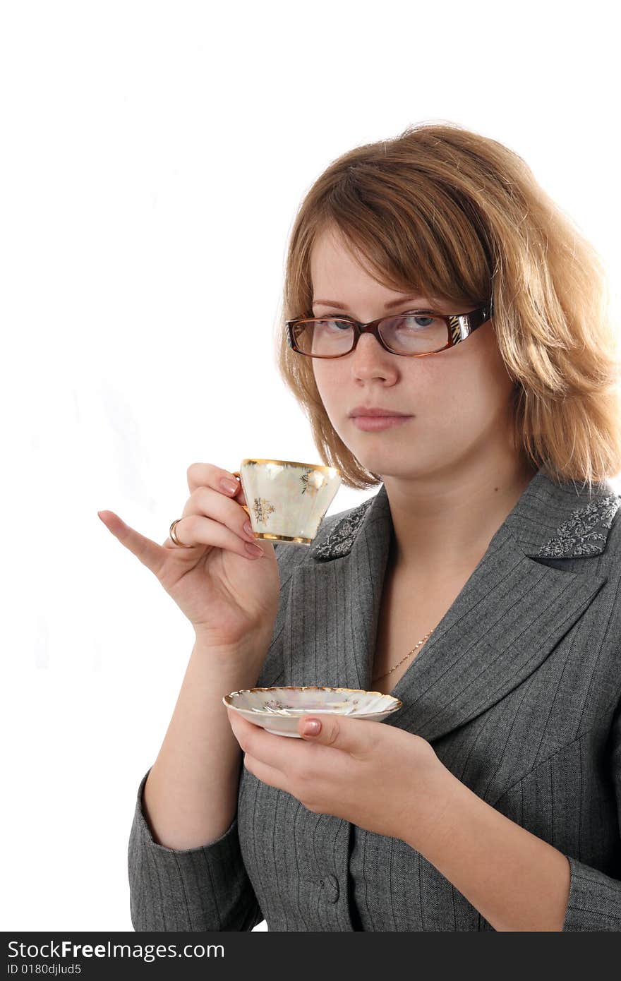 The young girl drinks coffee.