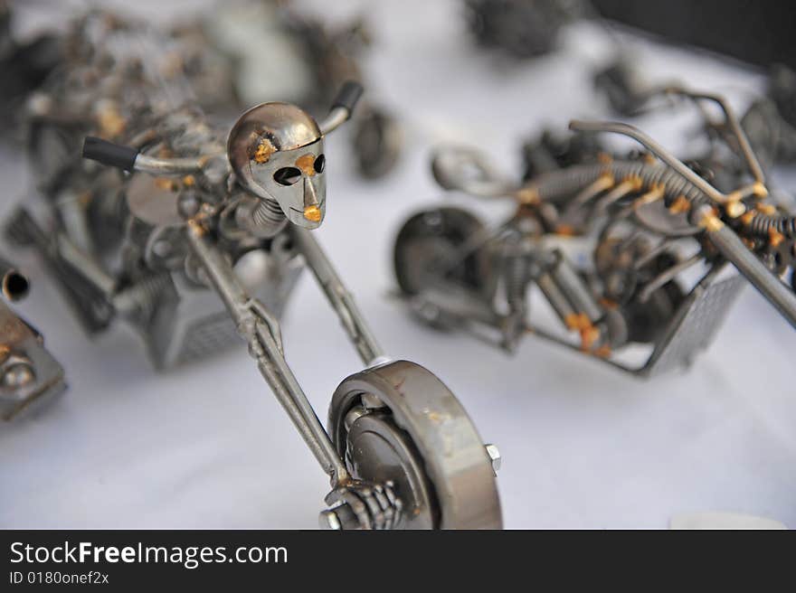 Toy motorcycle made from scrap metal,showing riders face. Toy motorcycle made from scrap metal,showing riders face