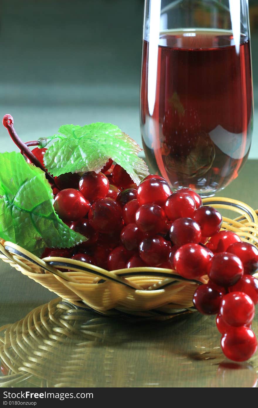 Plastic Grape with Basket and Wineglass on Table