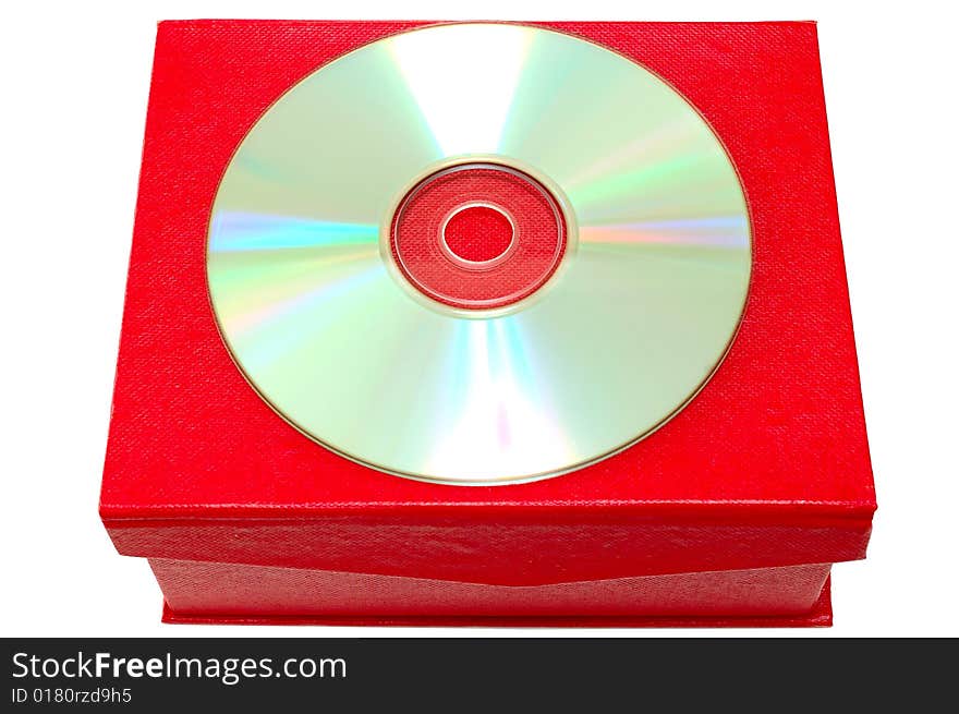 Compact-disk (CD or DVD) and red cardboard box on isolated background. Compact-disk (CD or DVD) and red cardboard box on isolated background.