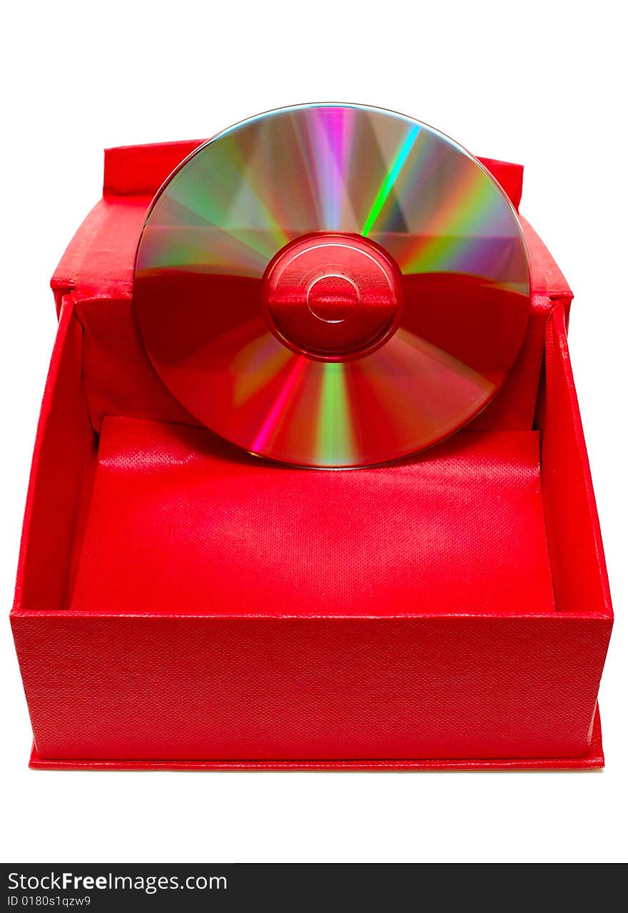 Compact-disk (CD or DVD) and red cardboard box on isolated background. Compact-disk (CD or DVD) and red cardboard box on isolated background.