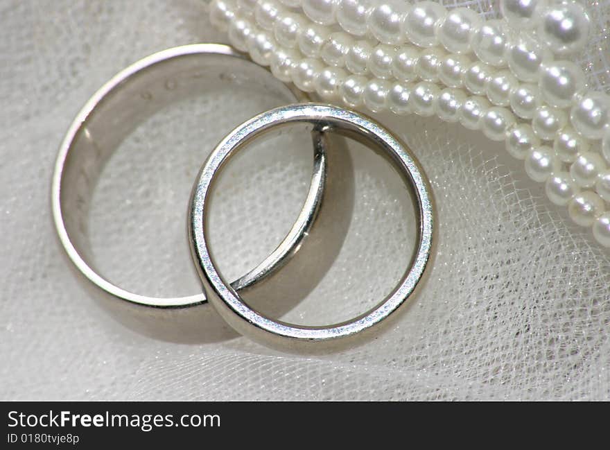 Wedding bands on veil with beads. Wedding bands on veil with beads