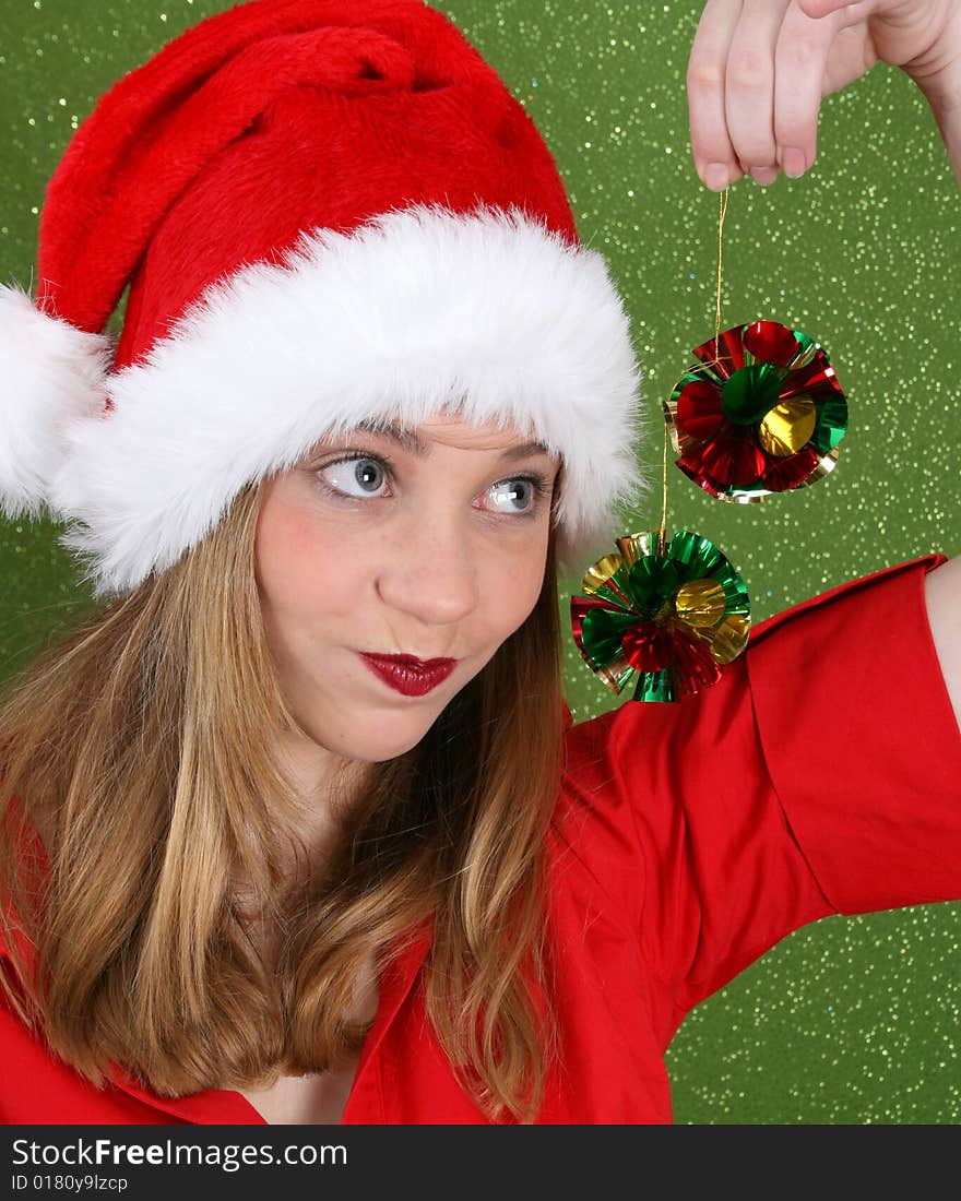 Teenager with red lips wearing a christmas hat. Teenager with red lips wearing a christmas hat