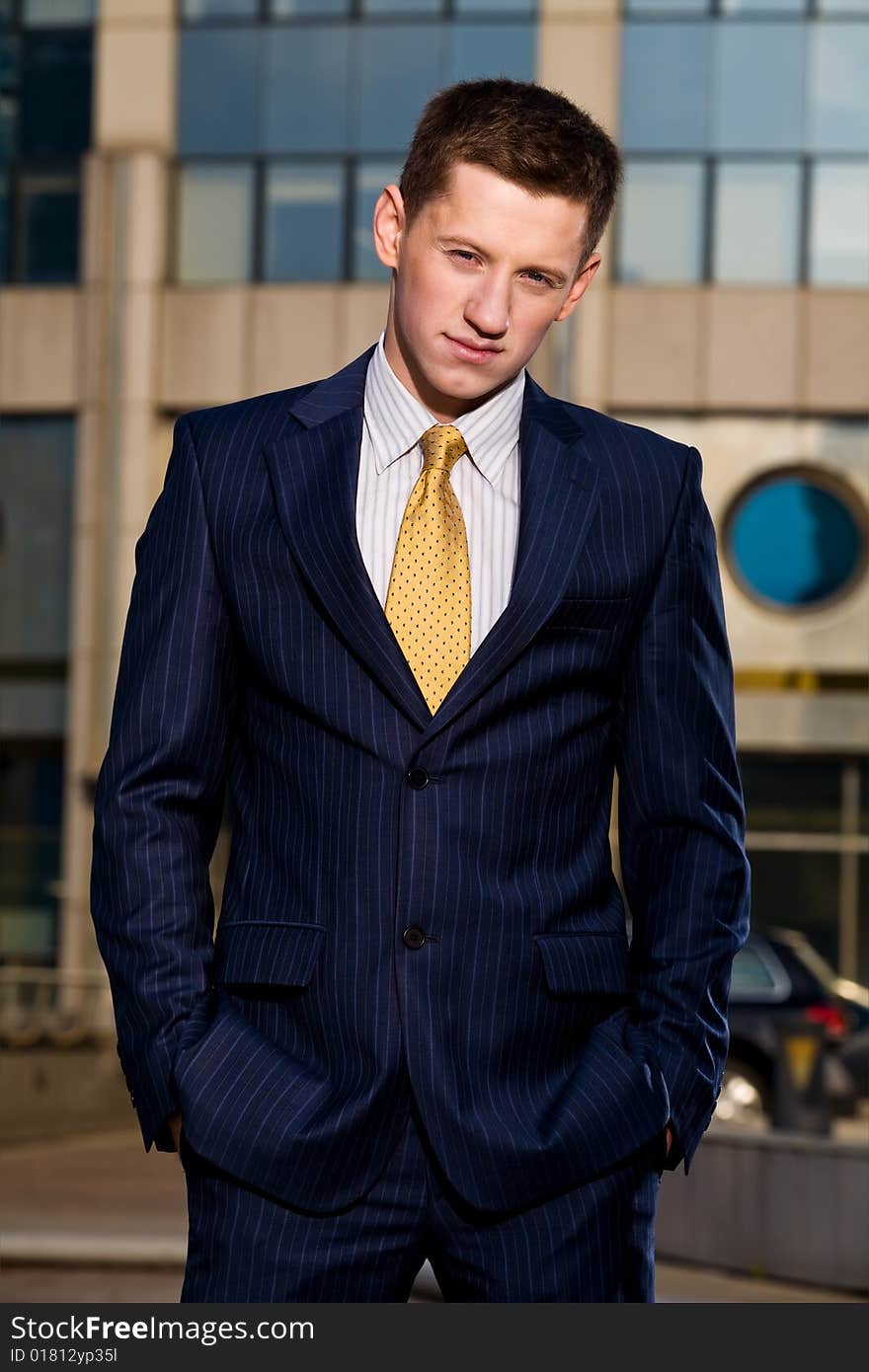 Portrait of young businessman outdoors