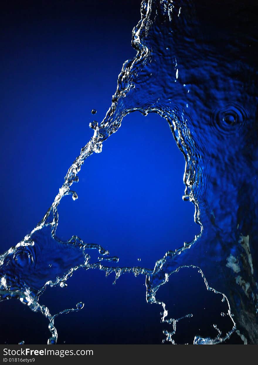 Falling water on blue. Very high resolution. Falling water on blue. Very high resolution.