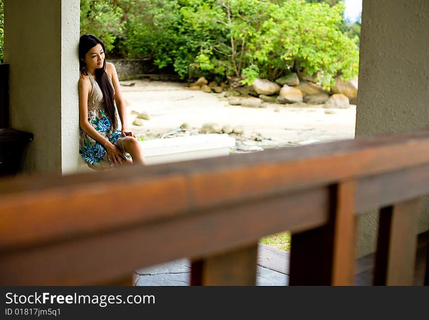 Woman relaxing under the hut