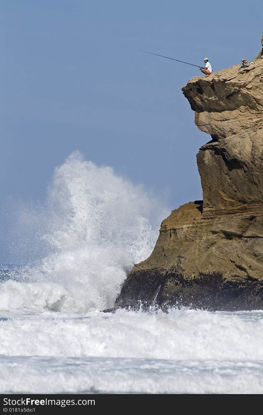 Fisherman on clifftop