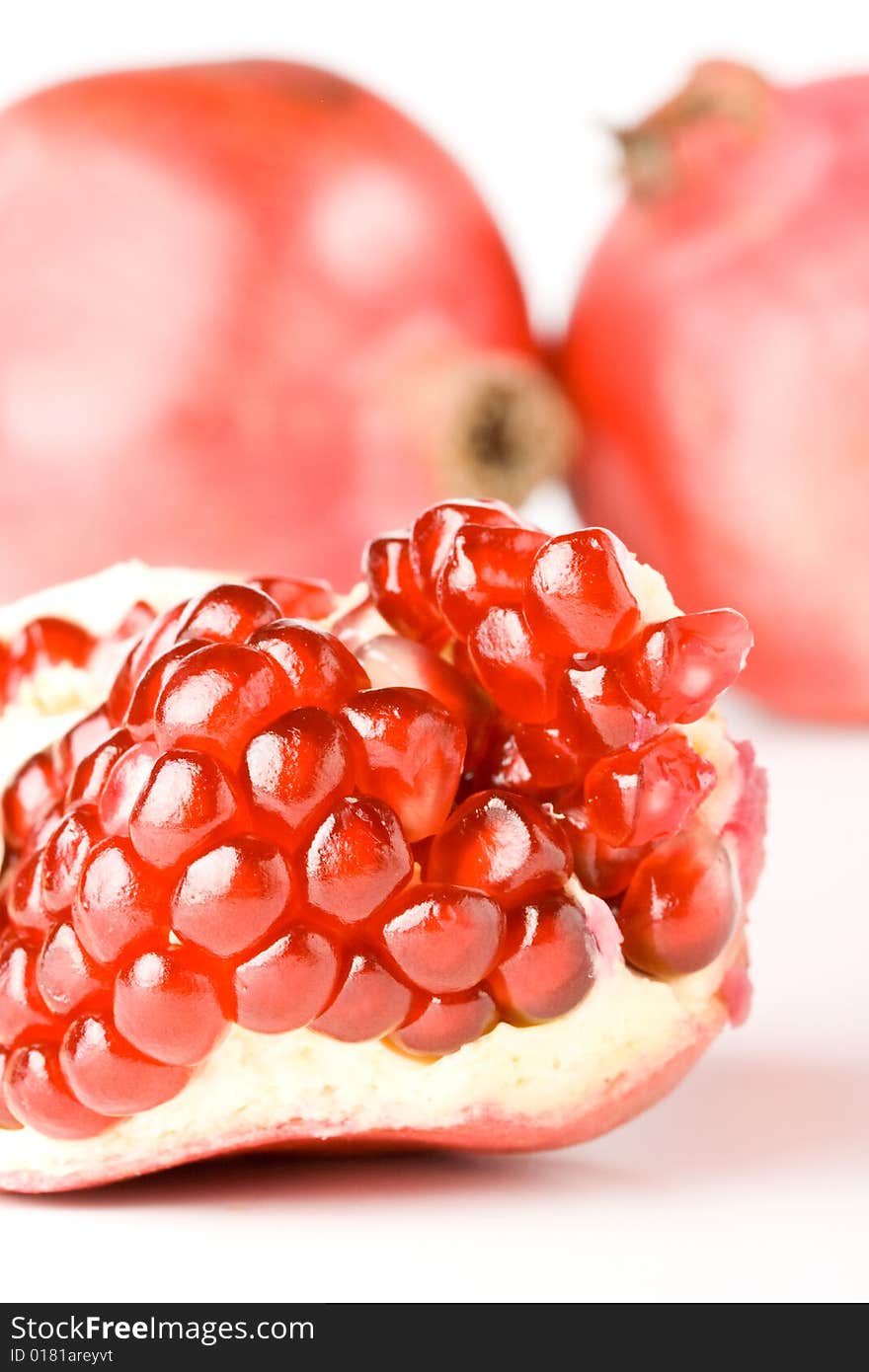 Fresh appetizing pomegranate on a white background. Fresh appetizing pomegranate on a white background