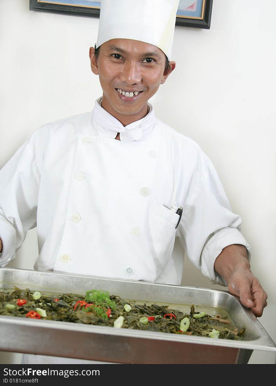 Chef holding food for buffet