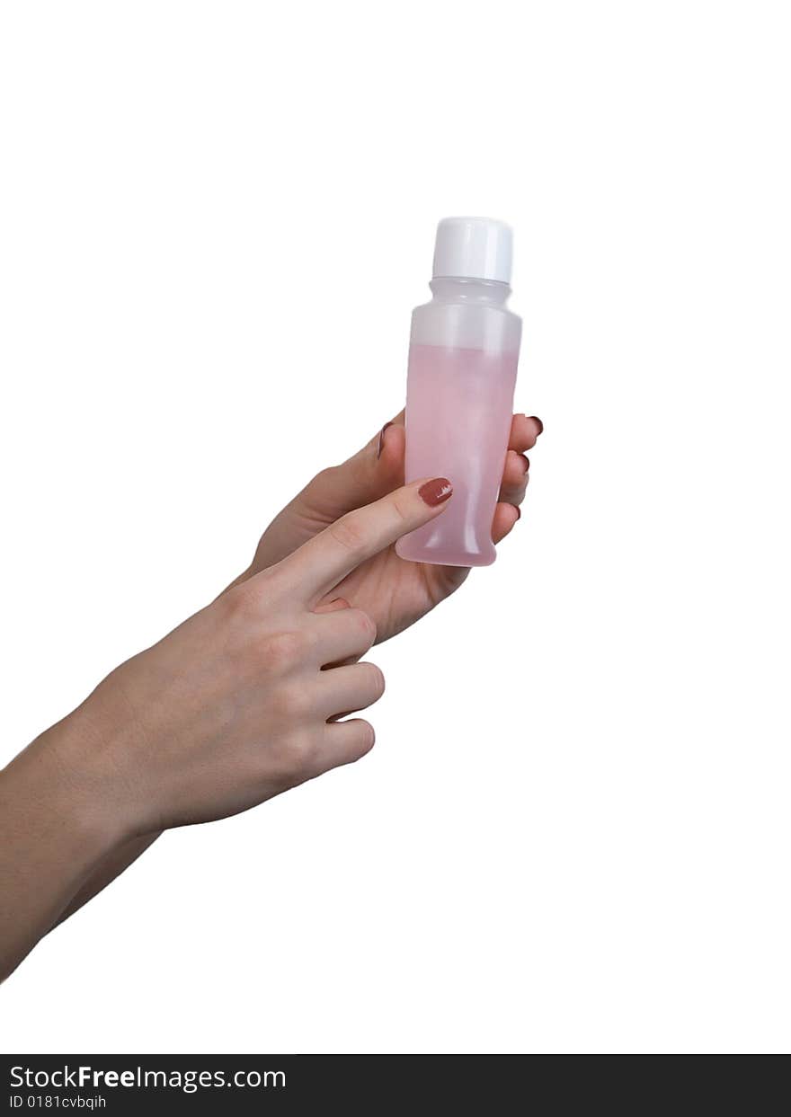 Female hands hold a small bottle with perfumery on a white background. Female hands hold a small bottle with perfumery on a white background