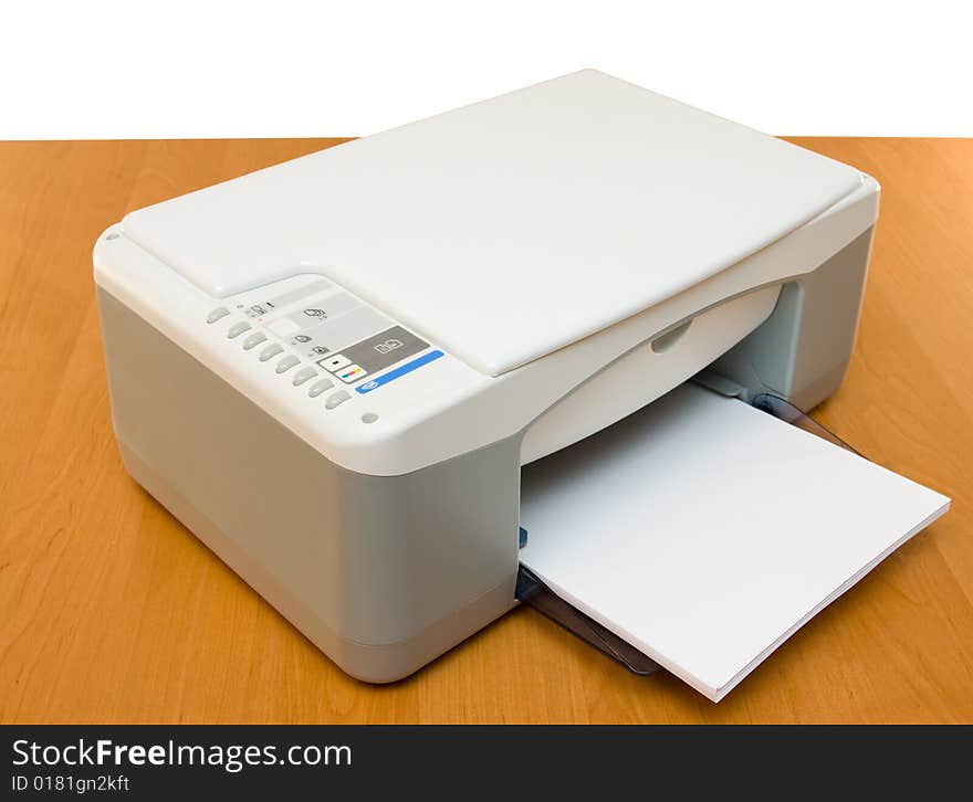 Printer placed on a wood table