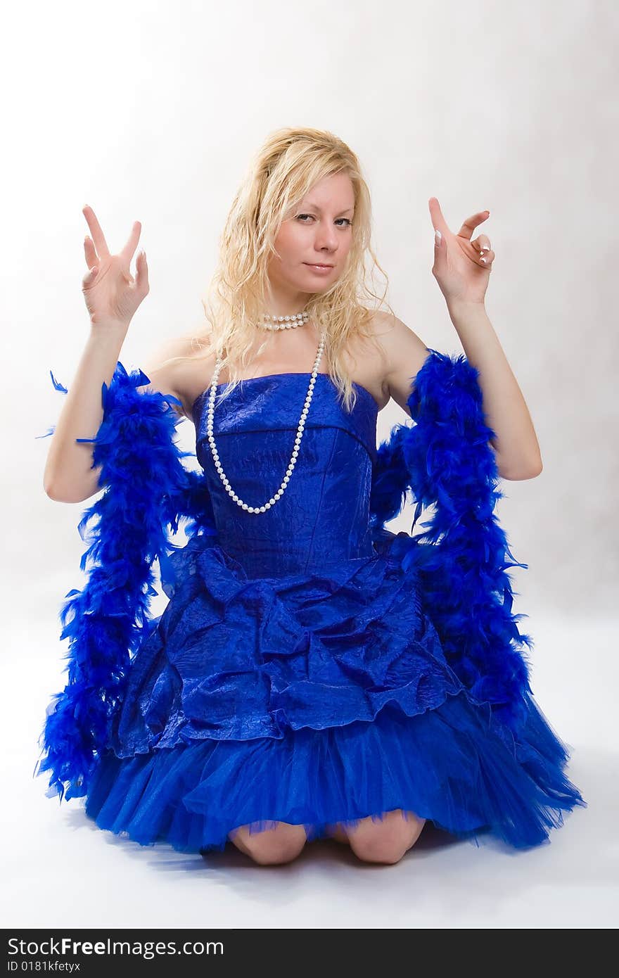 Beautiful girl in a dark blue dress on a white background. Beautiful girl in a dark blue dress on a white background