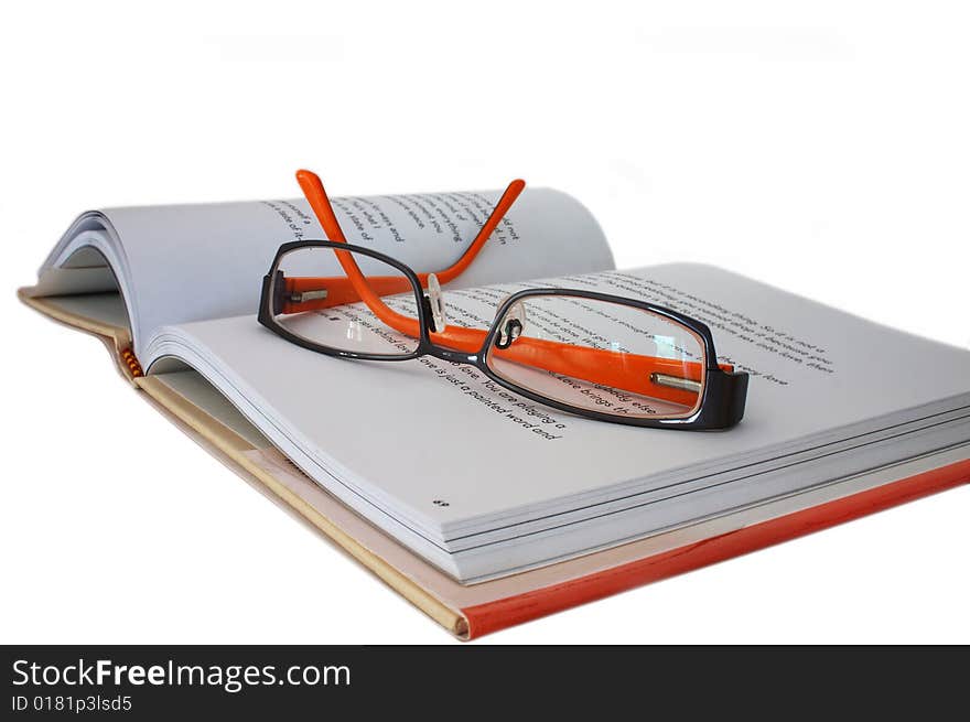 Spectacles on book