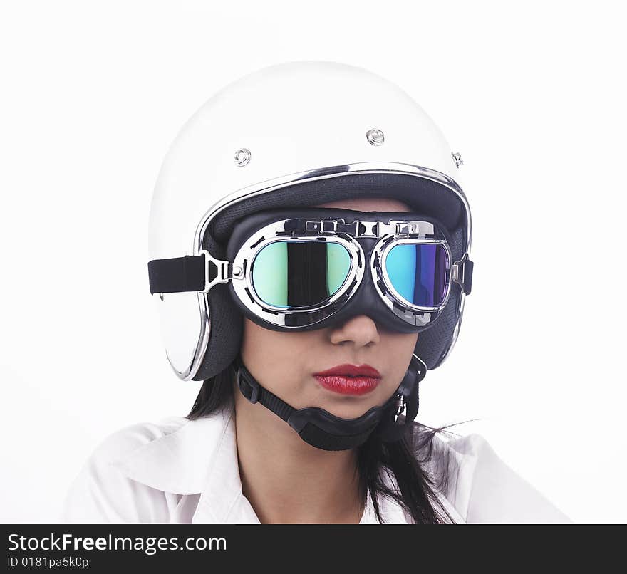 A pretty asian biker girl wearing a white helmet. A pretty asian biker girl wearing a white helmet