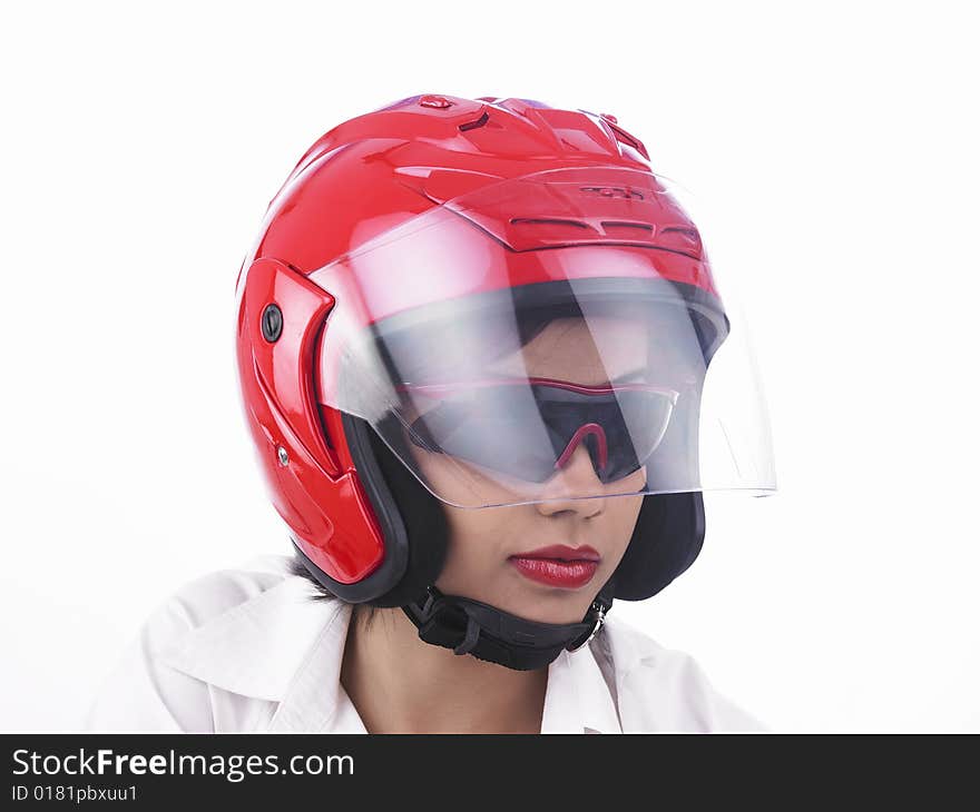 A asian biker girl of indian origin wearing a helmet. A asian biker girl of indian origin wearing a helmet