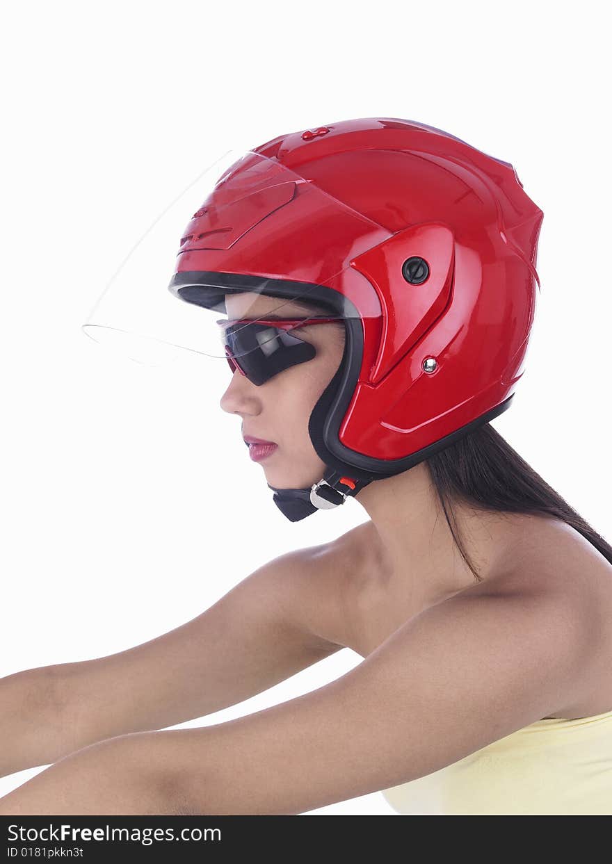 Asian biker girl of indian origin with a red helmet. Asian biker girl of indian origin with a red helmet