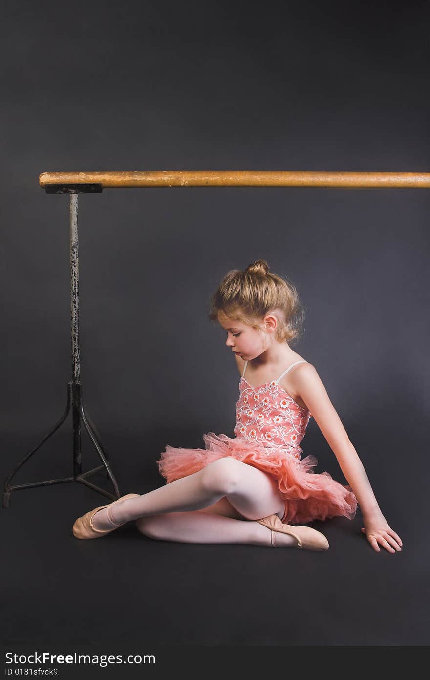 Young ballet dancer wearing an apricot tutu. Young ballet dancer wearing an apricot tutu