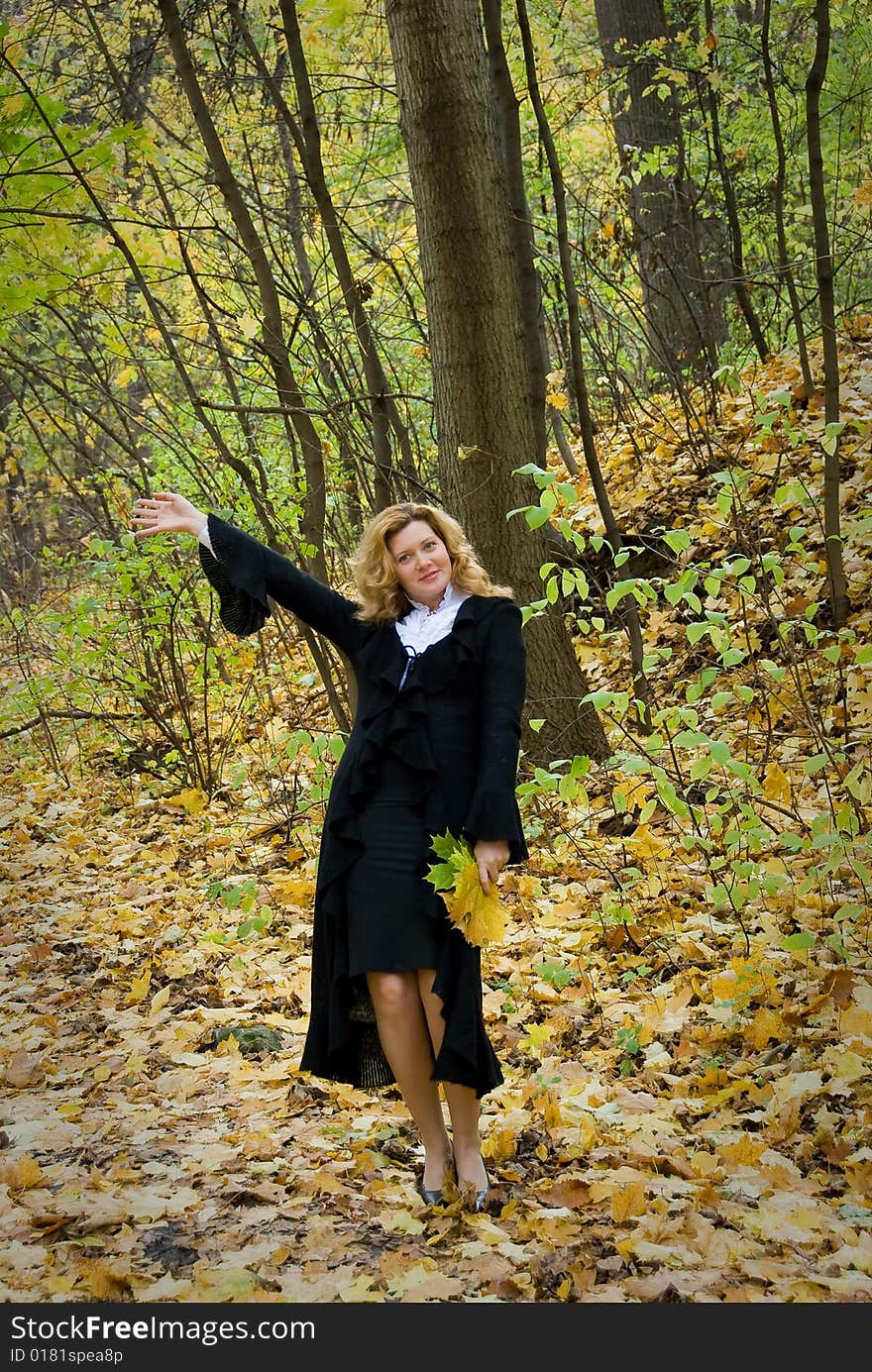 Middle age woman portrait in an autumn nature