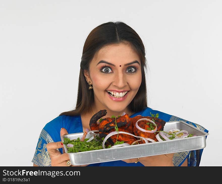 Asian woman with a baked chicken