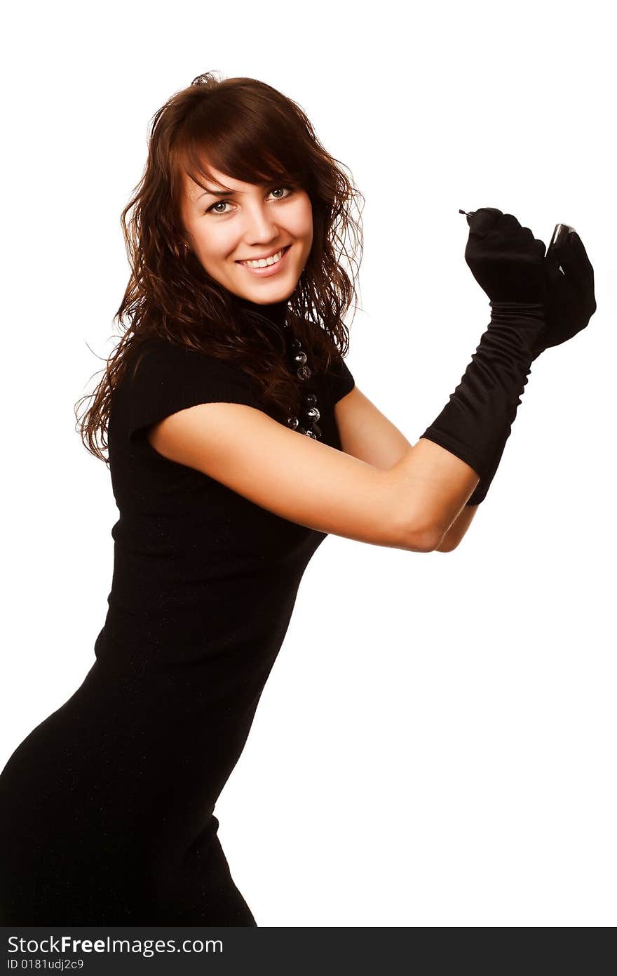 The girl in black clothes on a white background with a hat hat