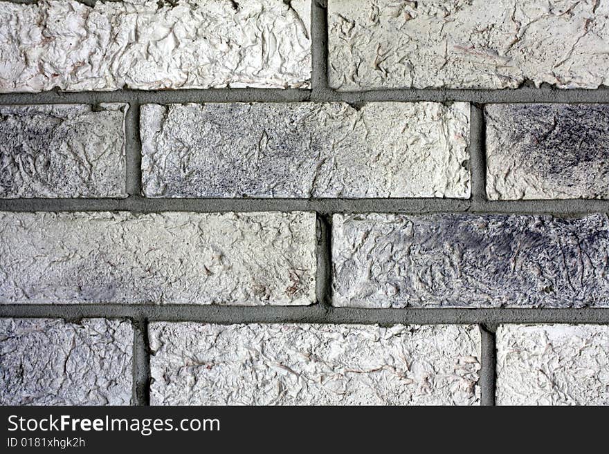 Part of gray brick wall. Part of gray brick wall