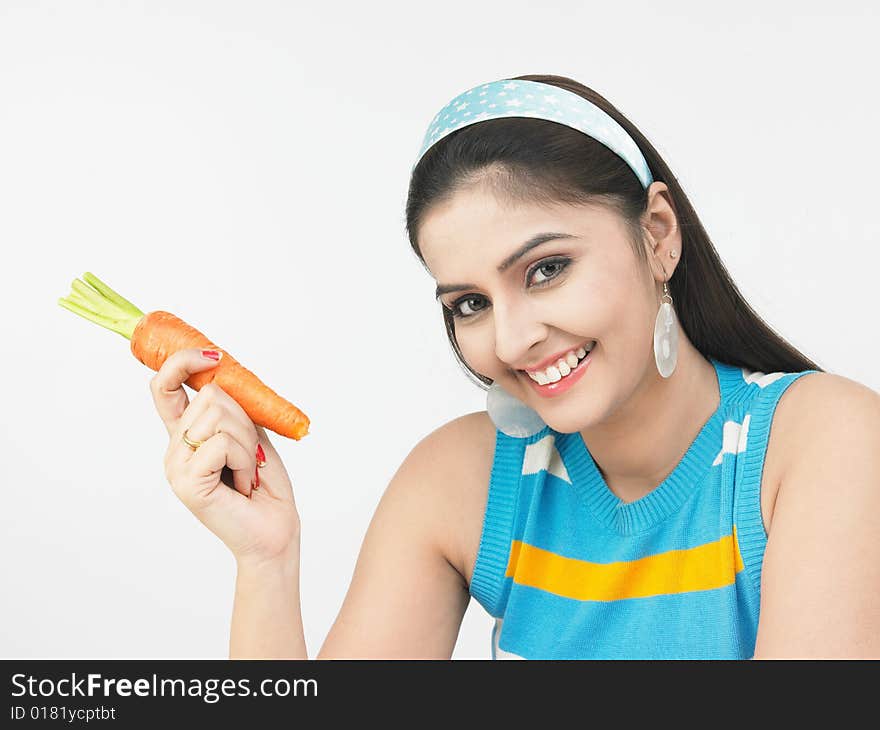 A beautiful asian female with a carrot