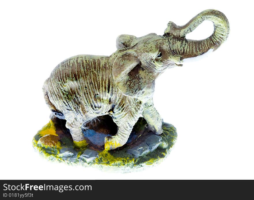 A small plastic toy elephant isolated on the white background