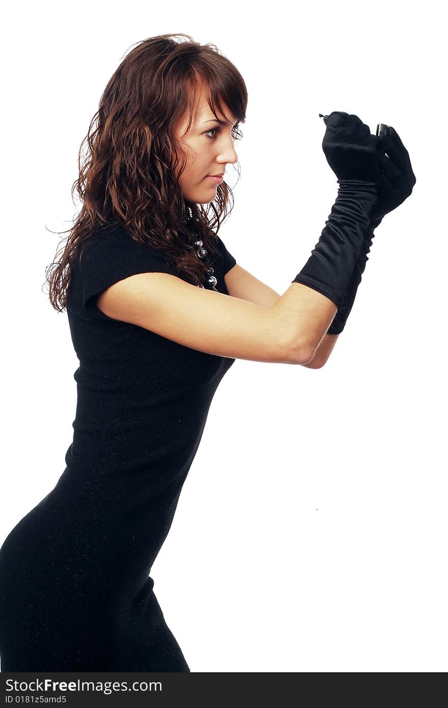 The girl in black clothes on a white background with a hat hat