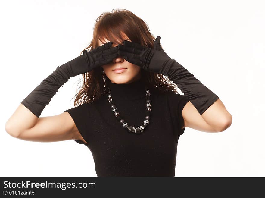 The girl in black clothes on a white background with a hat hat