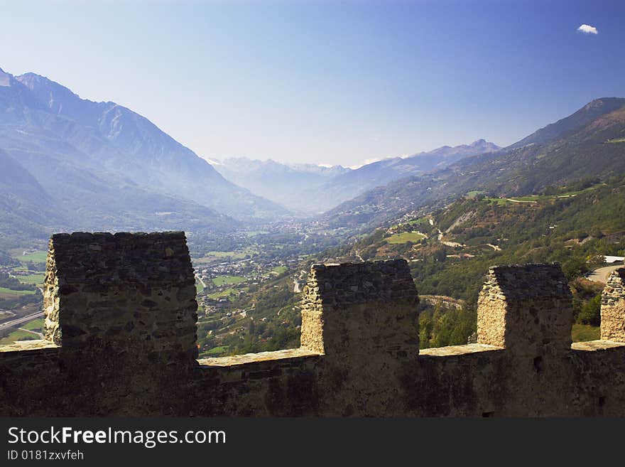 Mountain valley over the walls of medieval castle in Italy, Aosta region. Mountain valley over the walls of medieval castle in Italy, Aosta region.