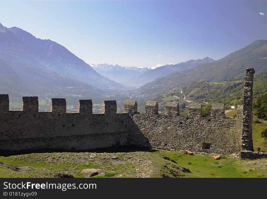 Mountain valley over the walls of medieval castle in Italy, Aosta region. Mountain valley over the walls of medieval castle in Italy, Aosta region.