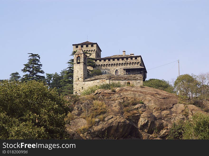 Small medieval castle on hiin Italy, Aosta region, horizontalll. Small medieval castle on hiin Italy, Aosta region, horizontalll