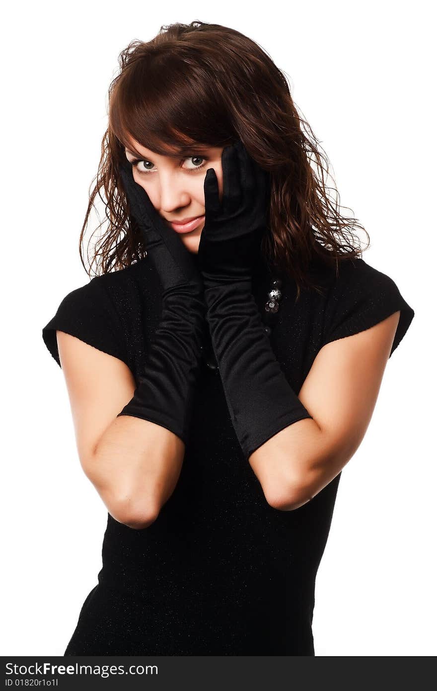 The girl in black clothes on a white background with a hat hat