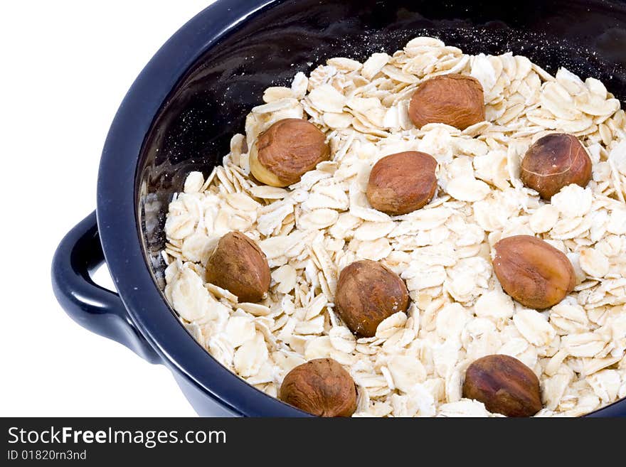 A bowl of oatmeal with hazelnuts - healthy diet