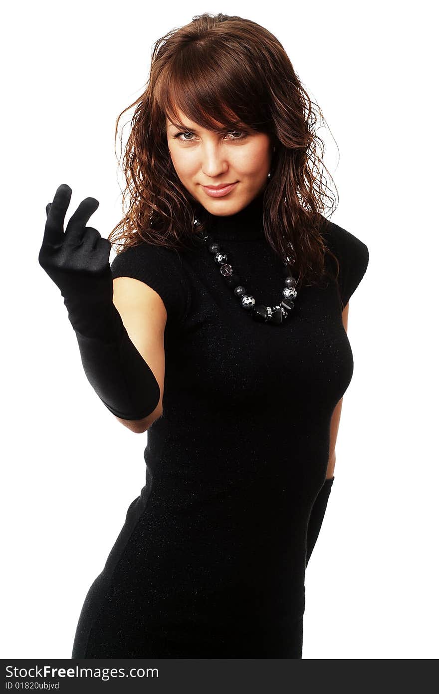 The girl in black clothes on a white background with a hat hat