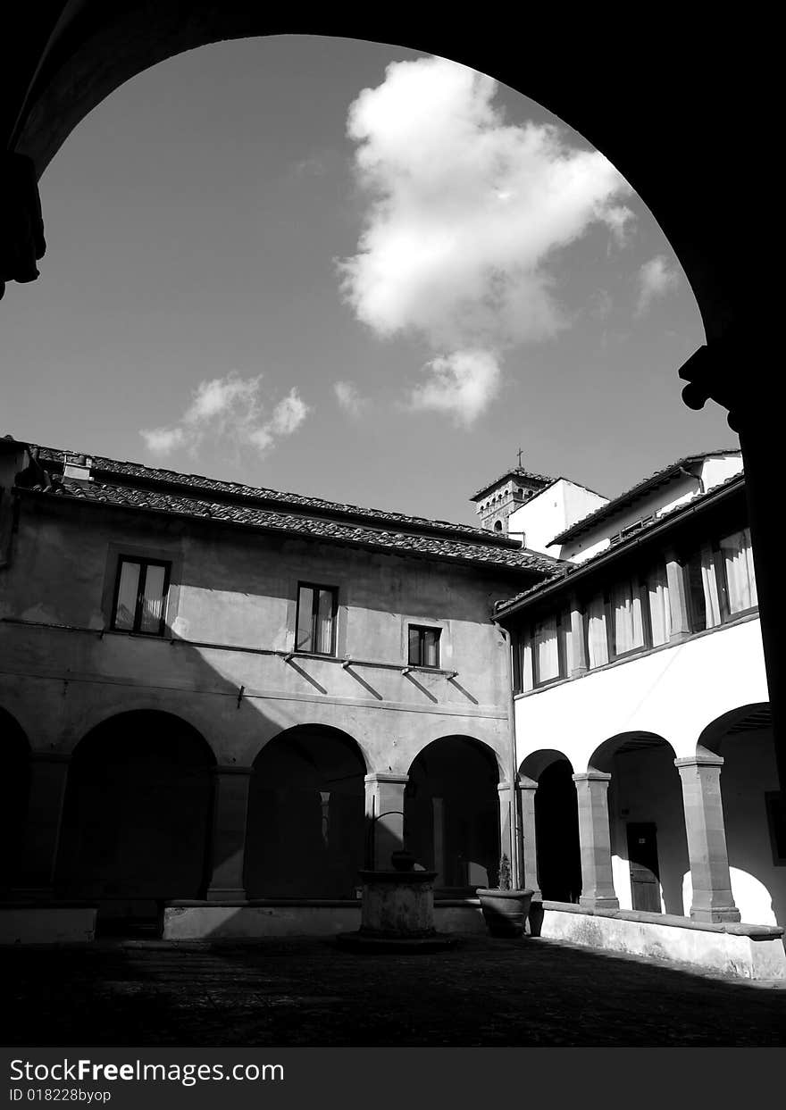 A suggestivemonochrome of an ancient cloister in Florence countryside